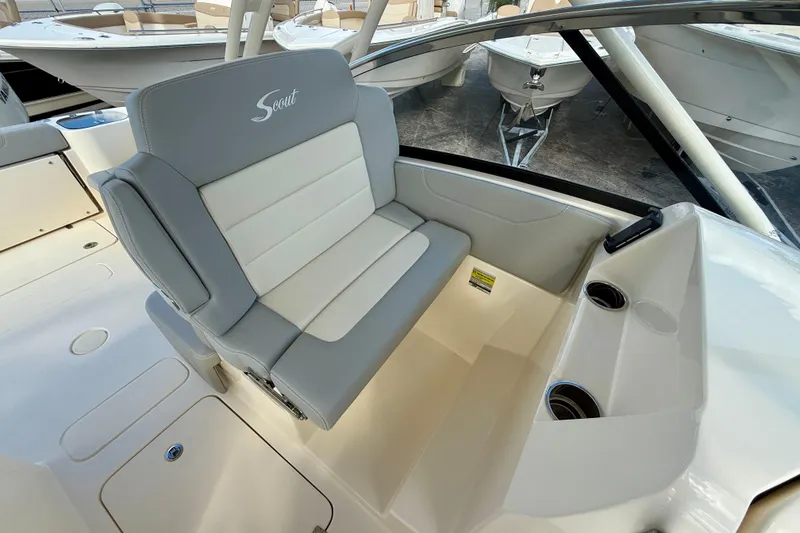 Slide: The Image of 2026 Scout 255 Dorado boat interior with comfortable seating and cup holders. - 15