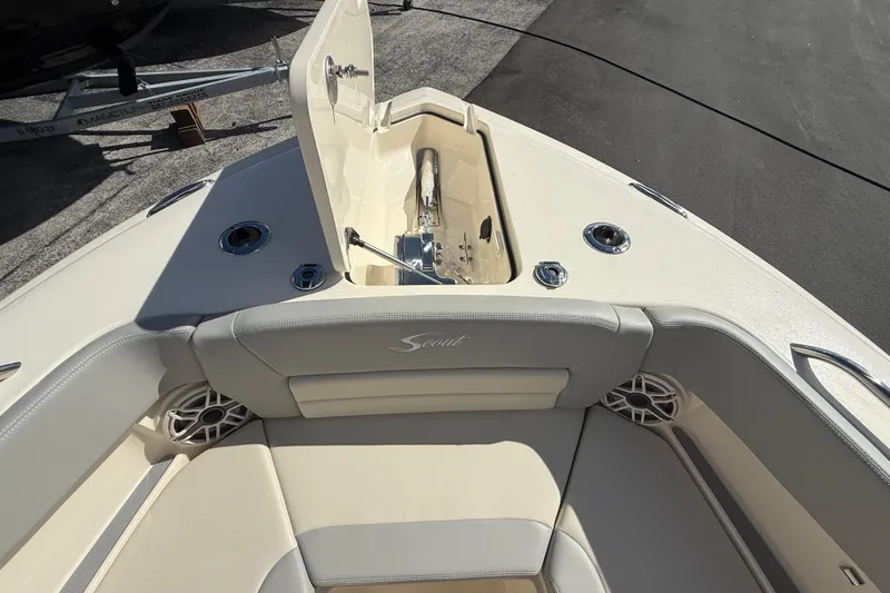 Slide: The Image of 2026 Scout 255 Dorado boat interior with open anchor compartment and seating area. - 25