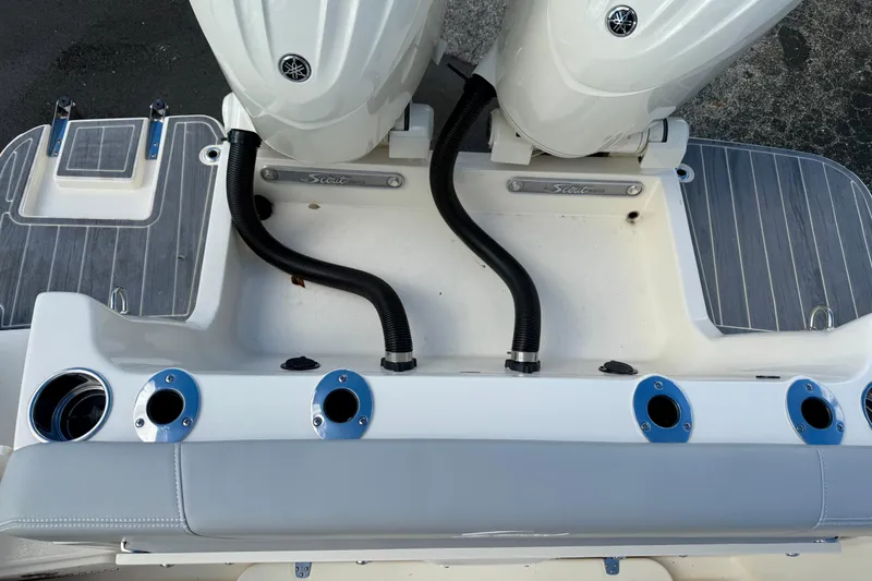 Slide: The Image of 2026 Scout 255 Dorado boat stern with dual engines and rod holders. - 4