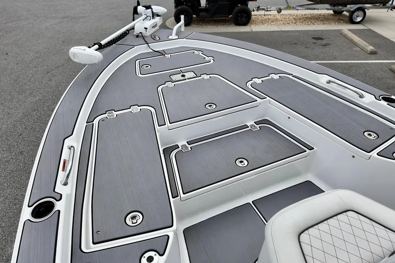 Slide: The Image of 2022 Sportsman Masters 207 Bay Boat deck with storage compartments and trolling motor. - 10