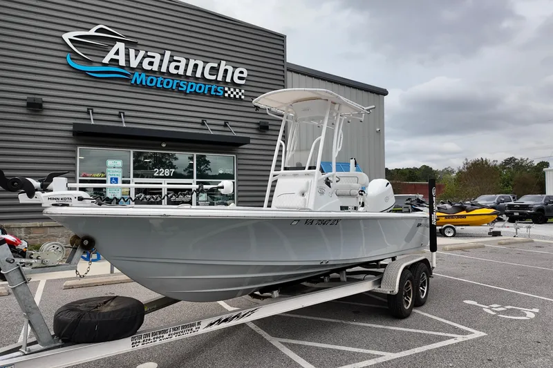 Slide: The Image of 2022 Sportsman Masters 207 Bay Boat on trailer at Avalanche Motorsports dealership. - 15