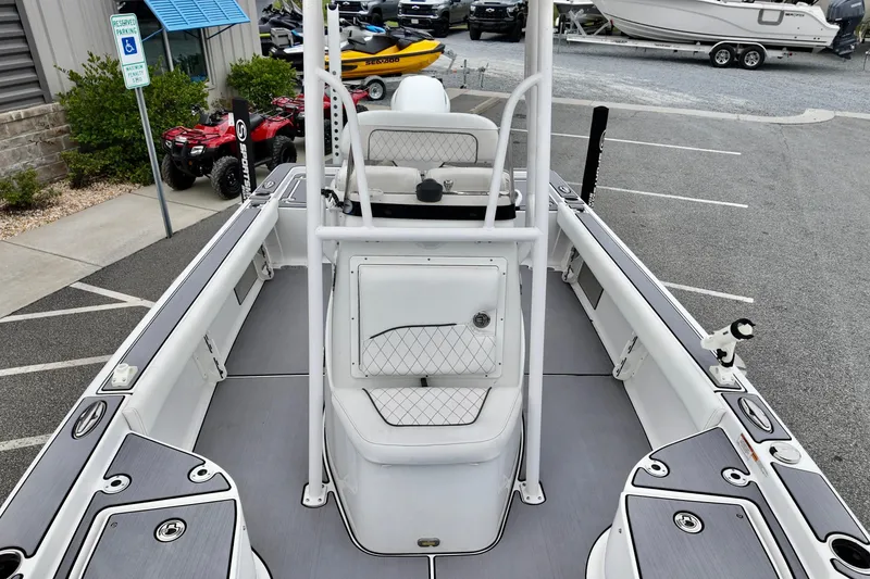 Slide: The Image of 2022 Sportsman Masters 207 Bay Boat interior view, showcasing seating and deck layout. - 8