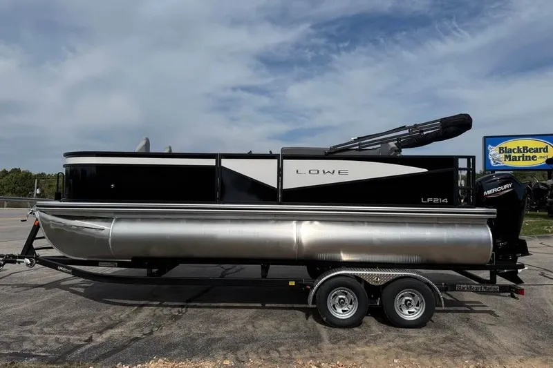 The Image of 2026 Lowe LF 214 pontoon boat on trailer at BlackBeard Marine dealership. - 0