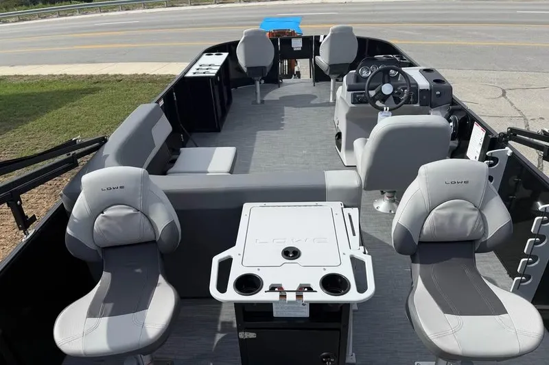 Slide: The Image of 2026 Lowe LF 214 boat interior with modern seating and steering console. - 6