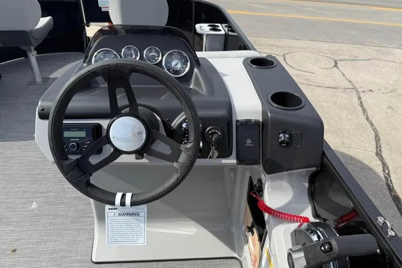 Slide: The Image of Steering console of 2026 Lowe LF 214 boat with gauges and controls. - 8