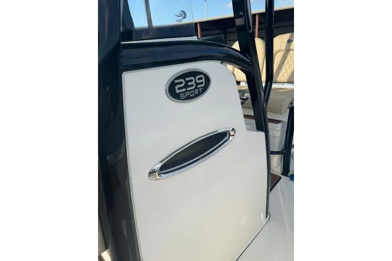 Slide: The Image of 2022 Sea Pro 239 Center Console boat, featuring sleek design and "239 Sport" emblem. - 16