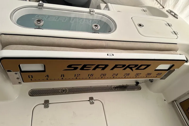 Slide: The Image of 2022 Sea Pro 239 Center Console boat interior with branded measuring board. - 17