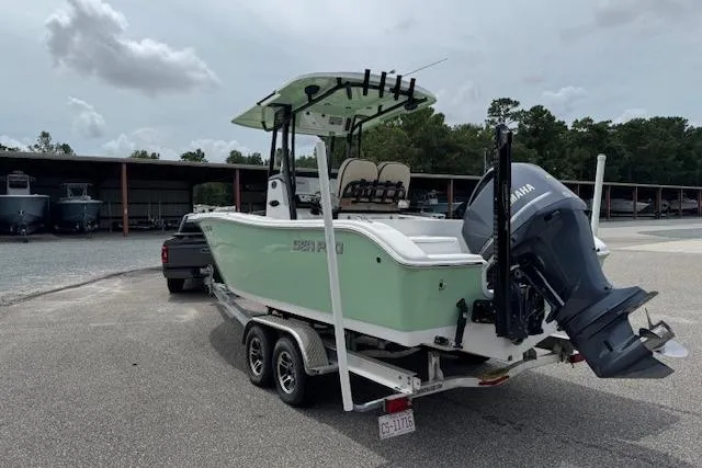 Slide: The Image of 2022 Sea Pro 239 Center Console boat on trailer, parked outdoors. - 4