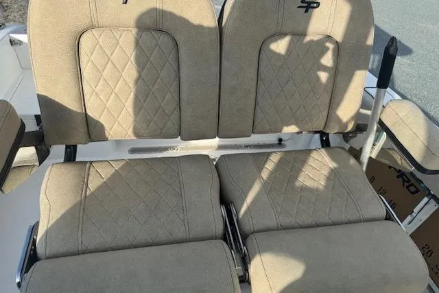 Slide: The Image of 2022 Sea Pro 239 Center Console boat seats with diamond-pattern upholstery. - 9