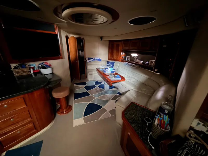 Slide: The Image of Luxurious interior of 2006 Cruisers Yachts 560 Express with elegant seating and modern decor. - 13