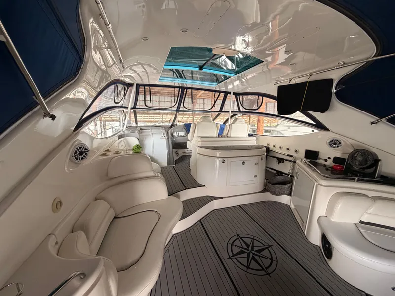 Slide: The Image of Luxurious interior of 2006 Cruisers Yachts 560 Express with elegant seating and modern amenities. - 6