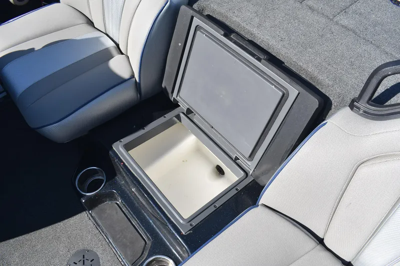 Slide: The Image of 2023 Skeeter ZXR20 boat interior with open storage compartment and seating. - 11