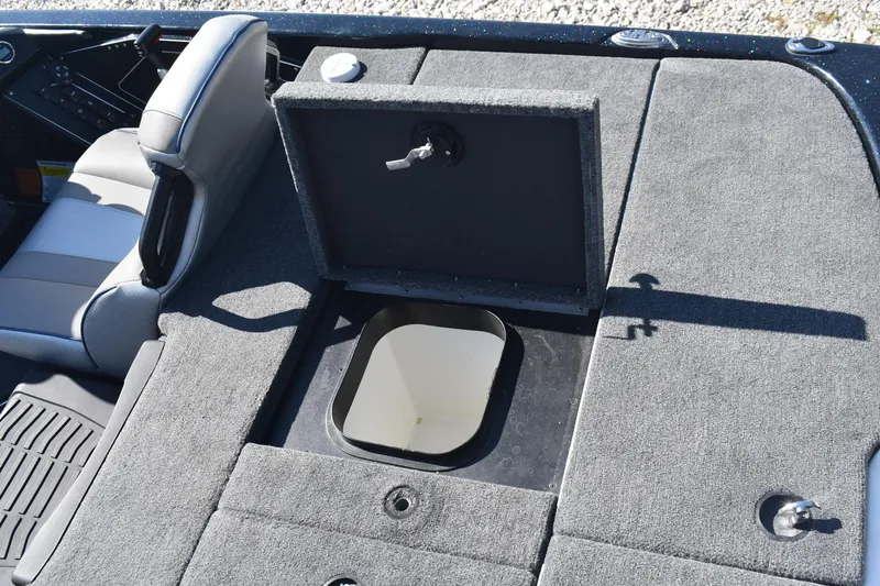 Slide: The Image of 2023 Skeeter ZXR20 boat interior with open storage compartment and seating. - 17