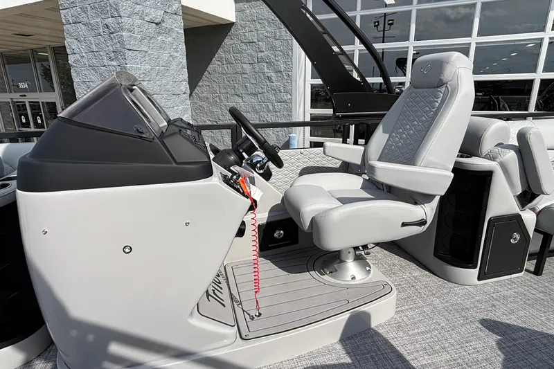 Slide: The Image of 2026 JC Sporttoon 26TT boat helm with luxurious seating and modern controls. - 18