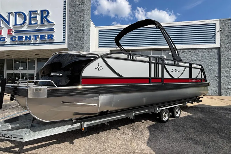 The Image of 2026 JC Sporttoon 26TT pontoon boat on trailer outside dealership. - 2