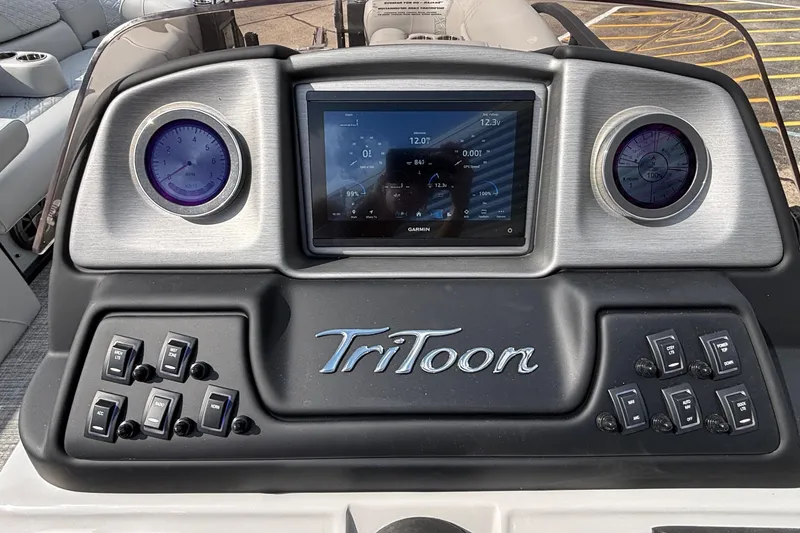 Slide: The Image of Dashboard of 2026 JC Sporttoon 26TT boat with digital display and controls. - 22