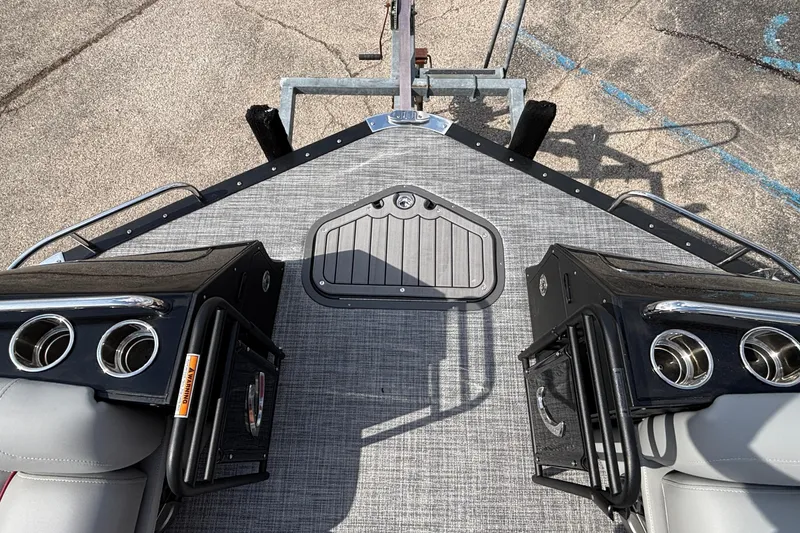 Slide: The Image of Deck view of 2026 JC Sporttoon 26TT pontoon boat with seating and cup holders. - 32