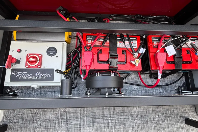 Slide: The Image of Battery control center of JC Sporttoon 26TT, 2026 model, featuring Odyssey batteries and wiring setup. - 9