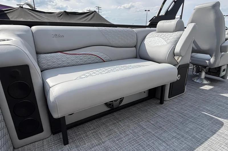 Slide: The Image of Luxurious seating on 2026 JC Sporttoon 26TT boat with quilted upholstery and integrated speakers. - 12