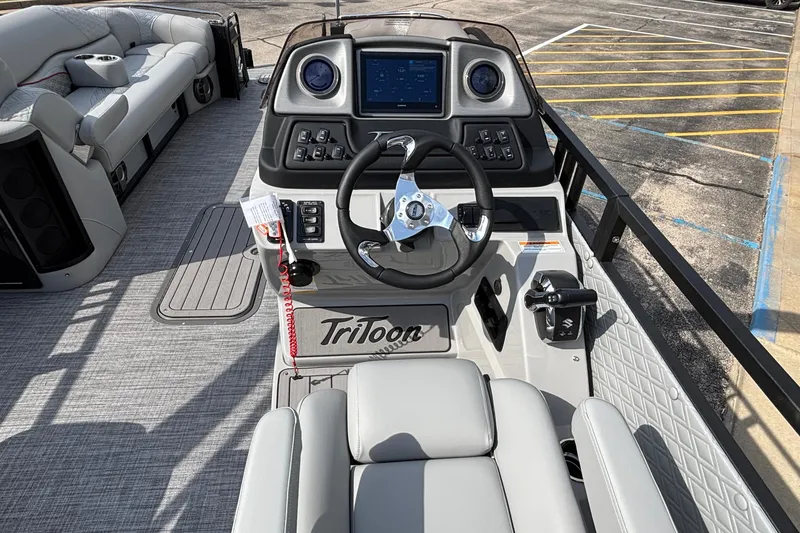 Slide: The Image of 2026 JC Sporttoon 26TT boat interior with modern dashboard and seating. - 20