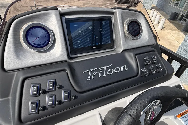 Slide: The Image of 2026 JC Sporttoon 26TT dashboard with digital display and control switches. - 21