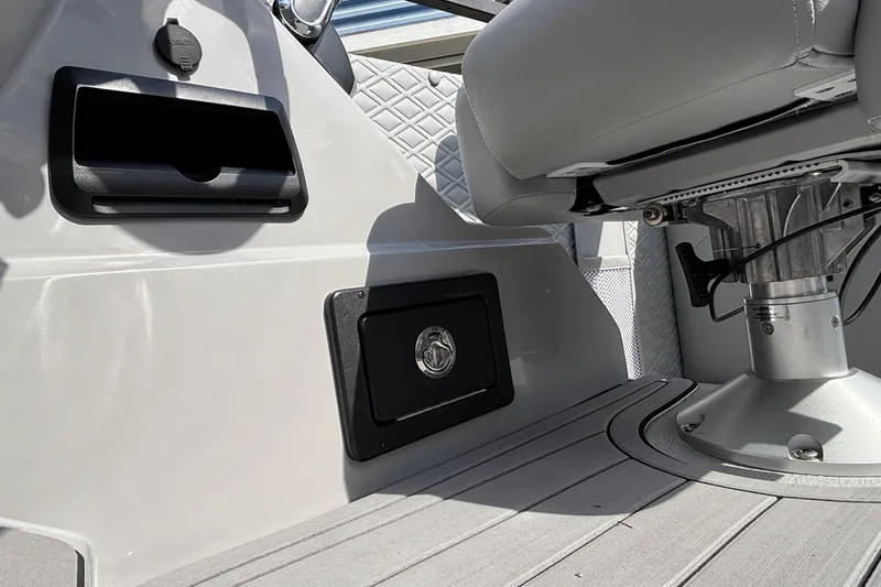 Slide: The Image of Interior of 2026 JC Sporttoon 26TT boat, featuring seating and storage compartments. - 23