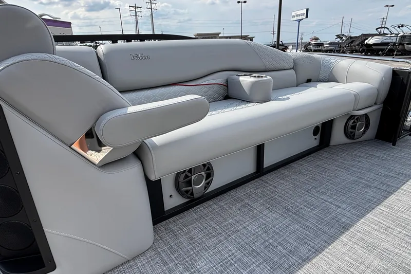 Slide: The Image of Luxurious seating on 2026 JC Sporttoon 26TT pontoon boat with integrated speakers and cup holders. - 28