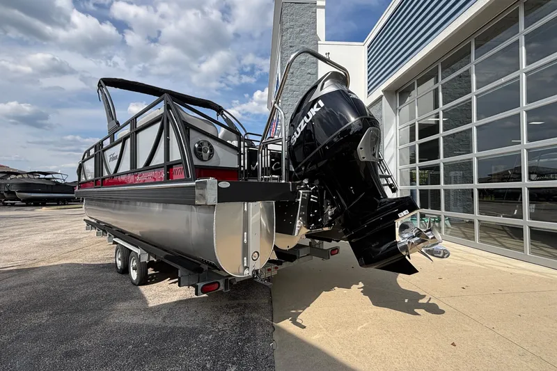 Slide: The Image of 2026 JC Sporttoon 26TT pontoon boat with Suzuki outboard motor on trailer. - 4