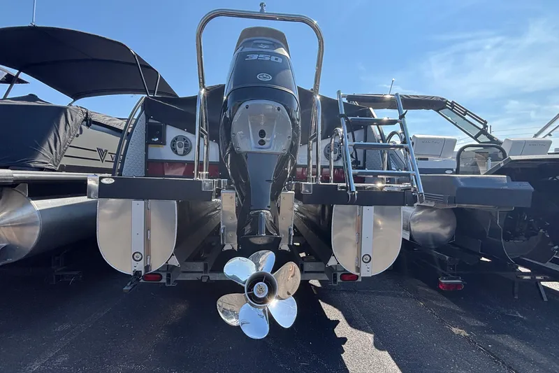 Slide: The Image of Rear view of 2026 JC Sporttoon 26TT boat with powerful outboard motor. - 5