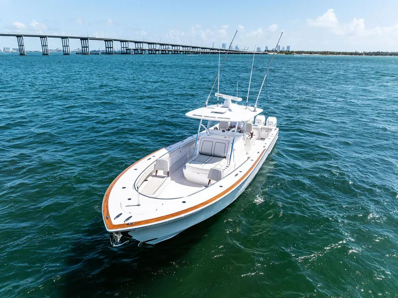 Slide: The Image of 2021 Valhalla Boatworks V-41 cruising on open water near a bridge. - 16