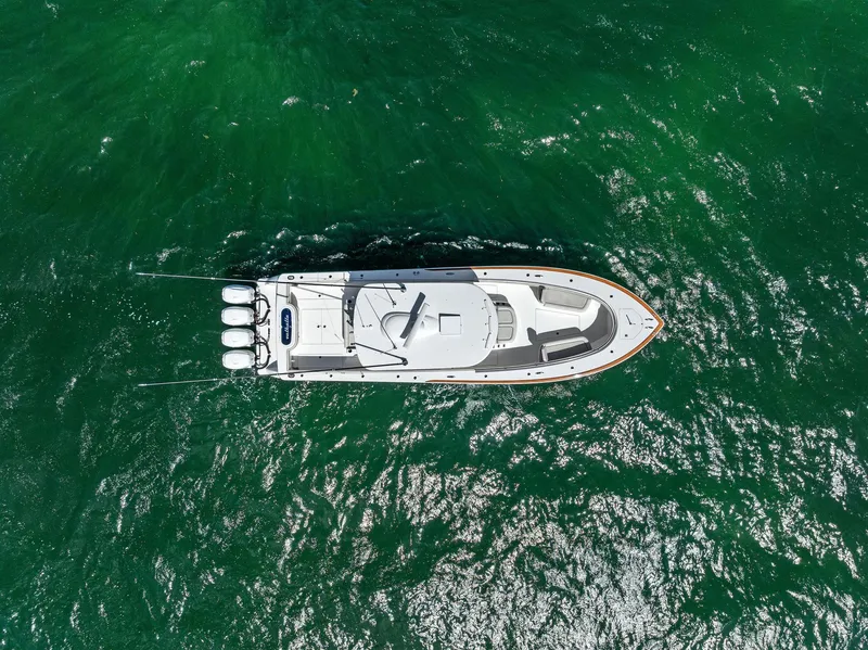 Slide: The Image of Aerial view of 2021 Valhalla Boatworks V-41 cruising on vibrant green water. - 18