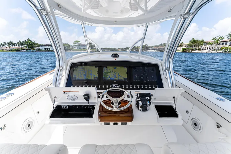 Slide: The Image of 2021 Valhalla Boatworks V-41 helm with advanced navigation system on a scenic waterway. - 36