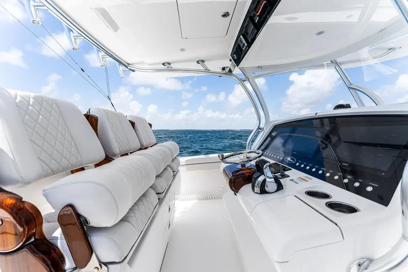 Slide: The Image of 2021 Valhalla Boatworks V-41 interior with luxurious seating and modern controls on open water. - 39
