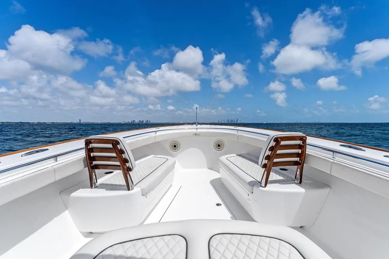 Slide: The Image of Valhalla Boatworks V-41, 2021 model, open deck with seating, ocean view, blue sky. - 48