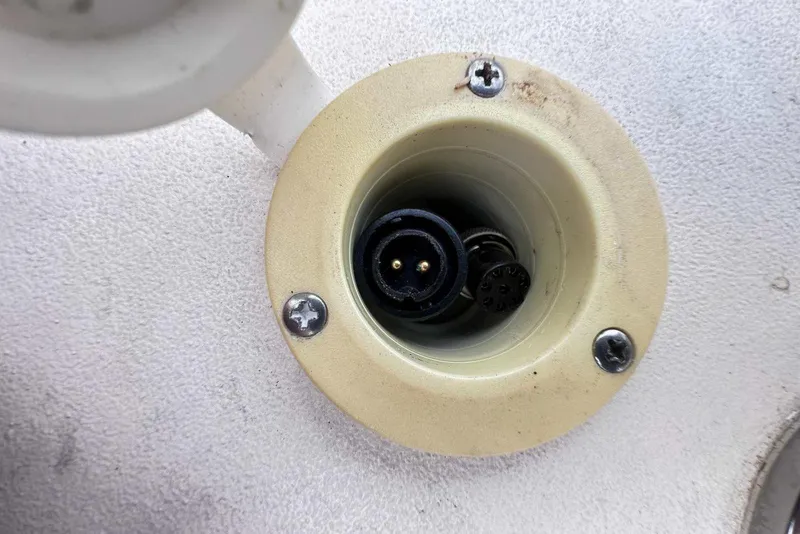 Slide: The Image of Close-up of a 2007 Grady-White Tournament 225 boat electrical socket. - 10