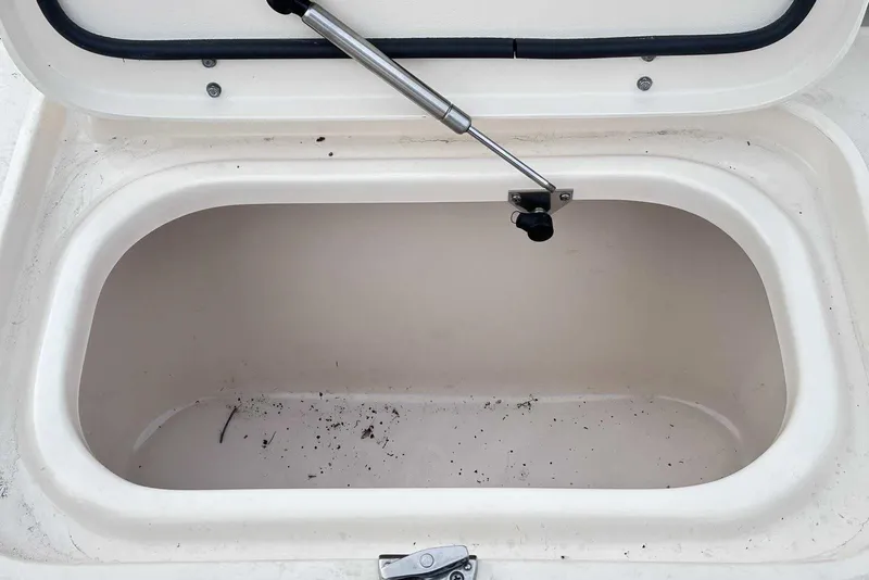 Slide: The Image of Open storage compartment on a 2007 Grady-White Tournament 225 boat. - 12