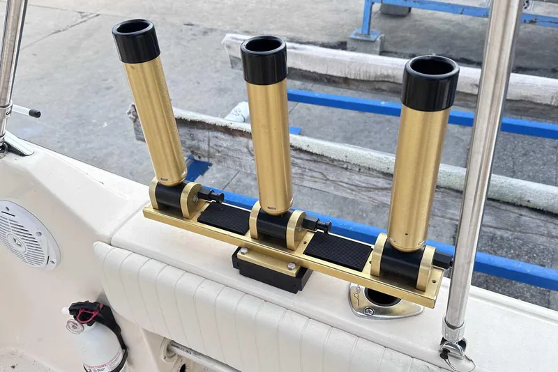 Slide: The Image of Gold rod holders on a 2007 Grady-White Tournament 225 boat deck. - 16