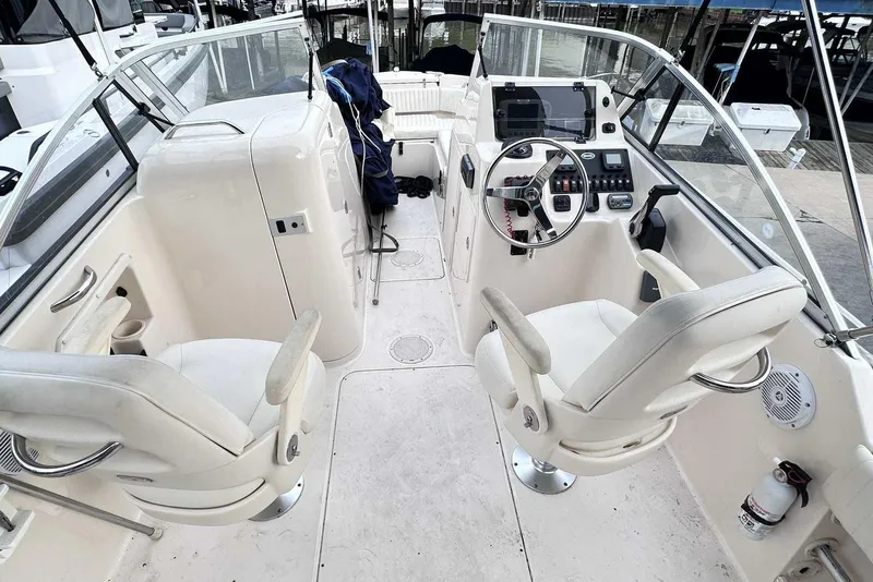 Slide: The Image of 2007 Grady-White Tournament 225 boat interior with dual helm seats and control panel. - 18