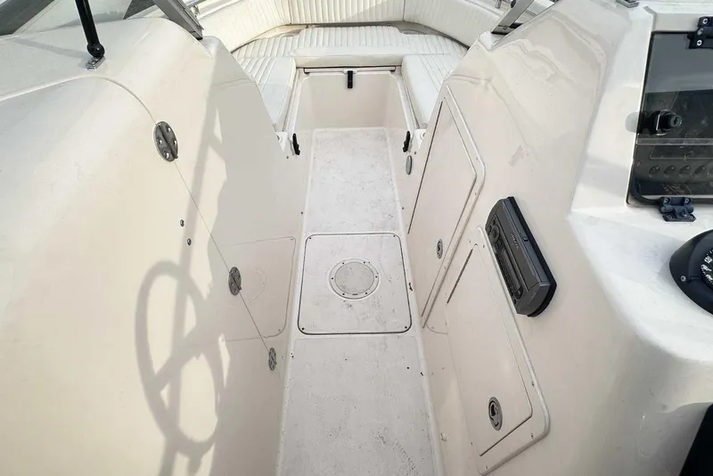 Slide: The Image of 2007 Grady-White Tournament 225 boat interior with seating and storage compartments. - 24