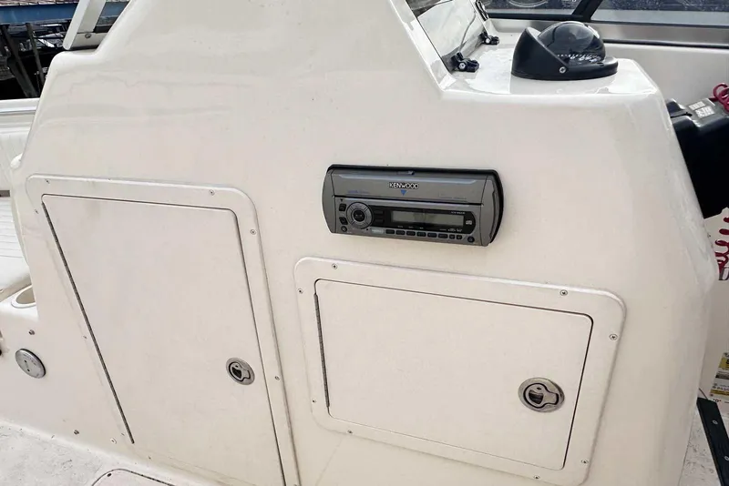Slide: The Image of 2007 Grady-White Tournament 225 boat dashboard with Kenwood stereo system. - 26