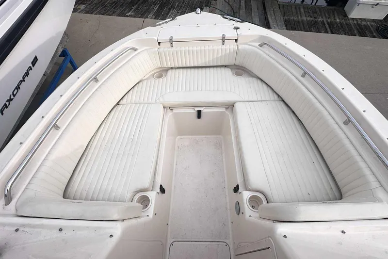 Slide: The Image of 2007 Grady-White Tournament 225 boat with spacious white seating area. - 29