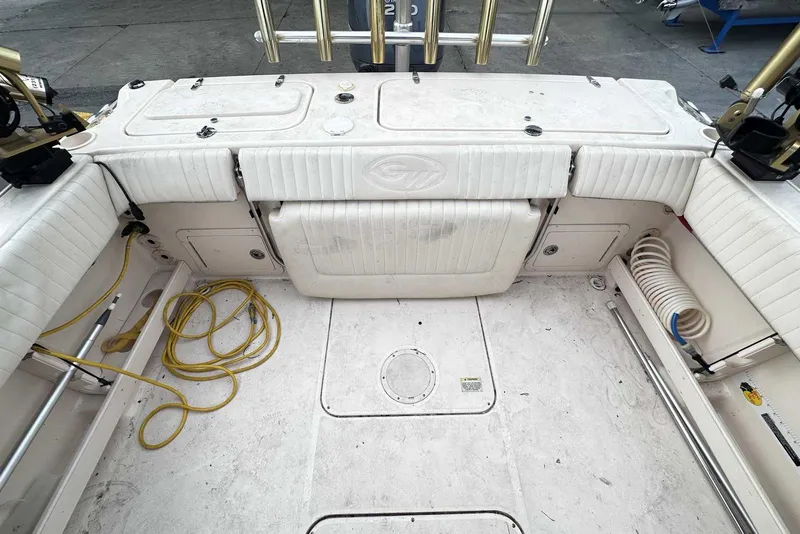 Slide: The Image of 2007 Grady-White Tournament 225 boat interior with seating and storage compartments. - 3