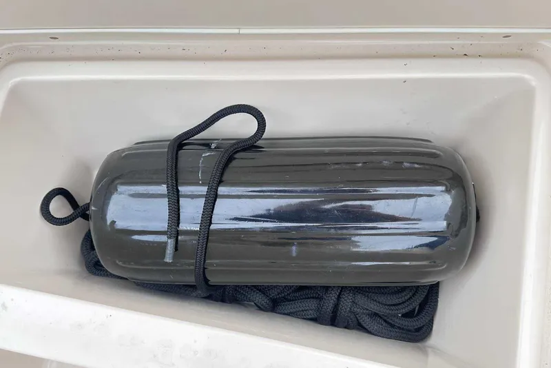 Slide: The Image of Boat fender with rope in storage compartment, Grady-White Tournament 225, 2007 model. - 32