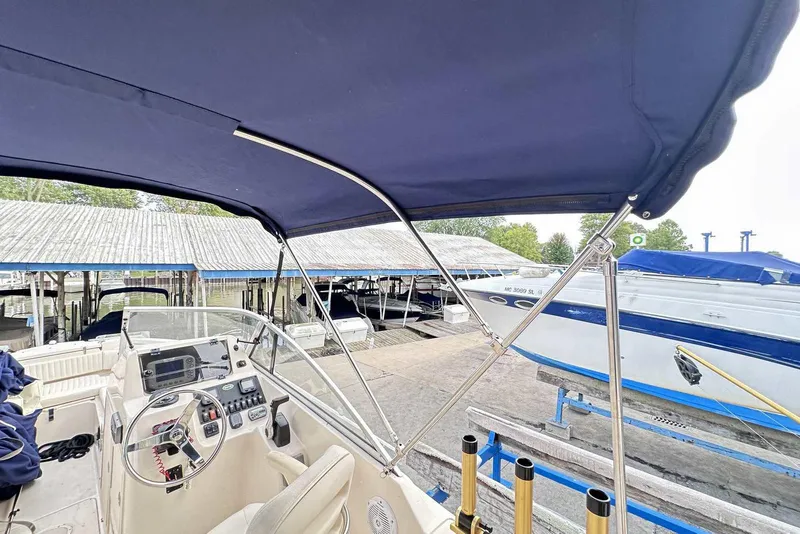 Slide: The Image of 2007 Grady-White Tournament 225 boat interior with canopy at marina. - 6