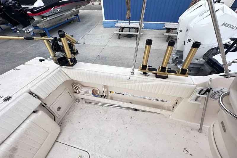 Slide: The Image of 2007 Grady-White Tournament 225 boat interior with rod holders and seating. - 9