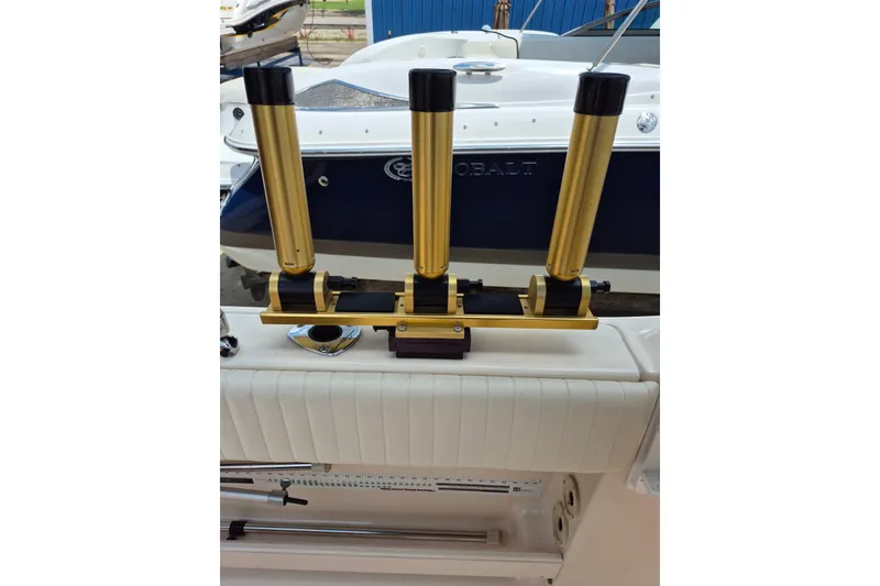 Slide: The Image of Triple gold rod holders on a 2007 Grady-White Tournament 225 boat. - 20