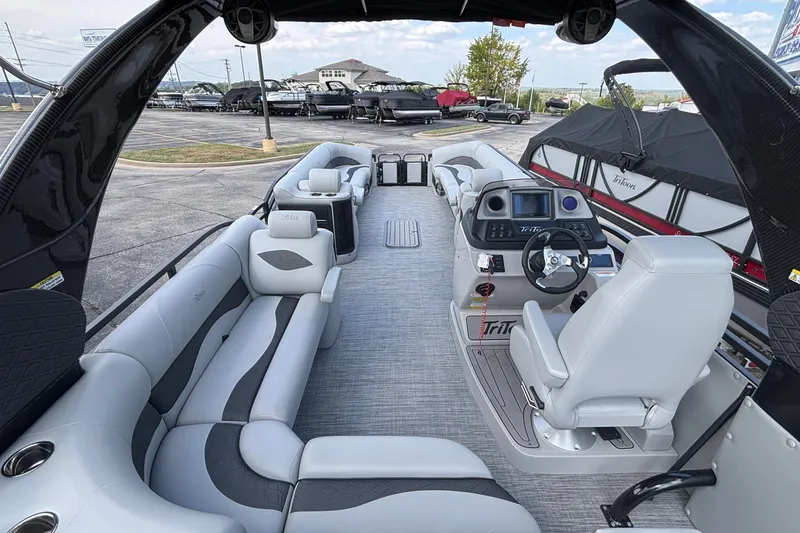 Slide: The Image of 2026 JC NEPTOON 27TT SPORT boat interior with modern seating and advanced dashboard. - 10