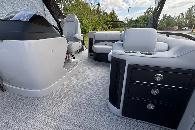 Slide: The Image of Interior of 2026 JC NEPTOON 27TT SPORT boat with modern seating and storage. - 13