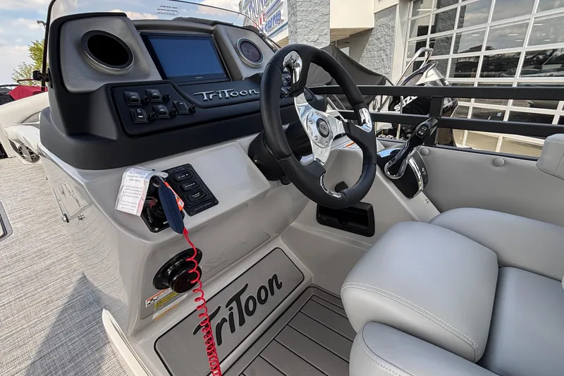 Slide: The Image of Interior of 2026 JC NEPTOON 27TT SPORT boat with steering wheel and controls. - 16