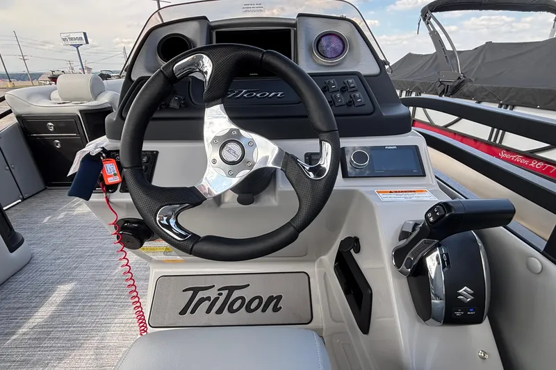 Slide: The Image of Steering console of 2026 JC NEPTOON 27TT SPORT boat with modern controls and dashboard. - 17